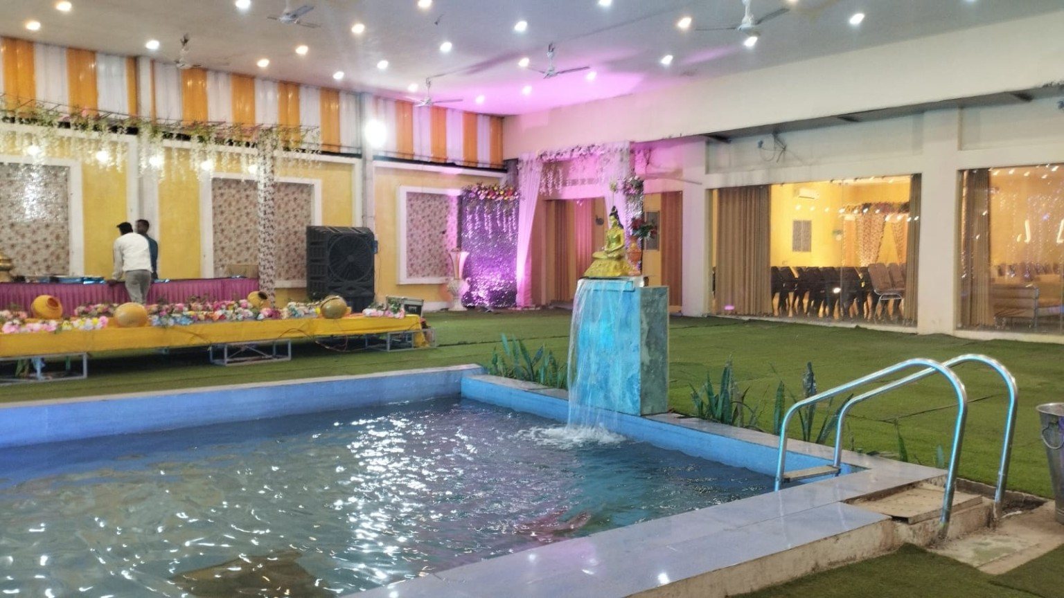 Pool deck and covered event area at Aamantran Greens
