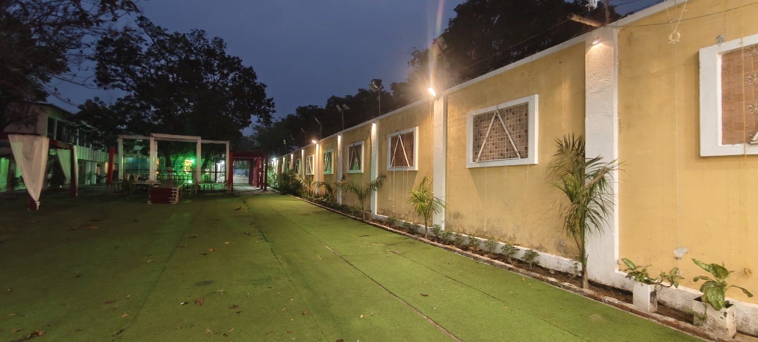 Outdoor venue pathway and event area at Aamantran Greens Dhanbad